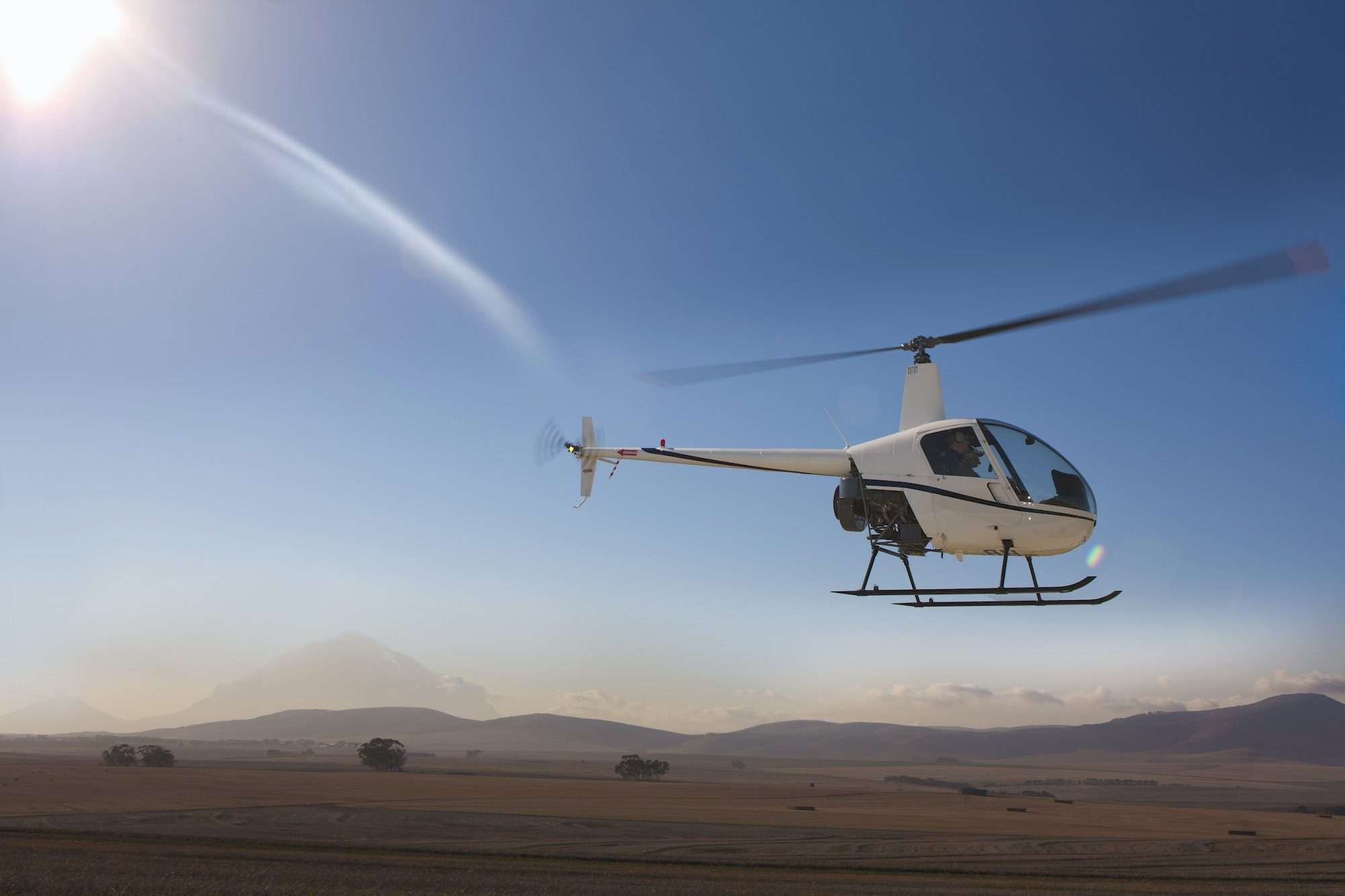 helicopter flying close to ground e1680917838568